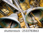 Old church bells in the bell tower resonate with history and faith. Their deep, timeless chimes echo through the air, calling worshippers to prayer. Housed in the tall steeple, these bells symbolize t