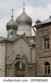 old church with domes next to the building, an example of the classical architecture of Russia in the 19th century