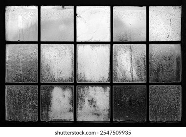 Old church windows with square single panes in a historic Gothic church in the Sauerland. Metal grid structure, black and white. Condensation with countless drops has formed on the handmade glass. - Powered by Shutterstock