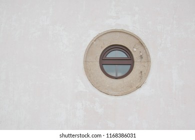 An Old Circular Window On White  Wall