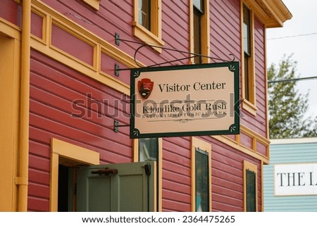 Old city center of Skagway, Alaska - Vintage store signboards on Broadway, the main shopping street of the Klondike Gold Rush National Historic Park