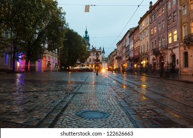 The Old City Of Lvov At Night In The Rain With Reflections On Wet Pavement