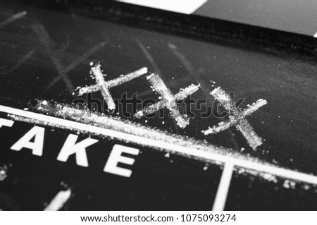 old  clapperboard labeled with chalk