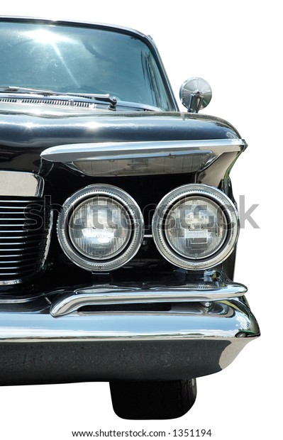 Old classic\
black vintage car headlights\
isolated