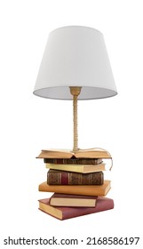 Old Classic Books Stacked With Innovative Lamp 