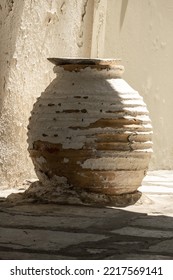 An Old Clay Pot In A Typical Antic Street