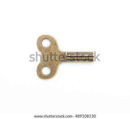 old clock key winder isolated on white background