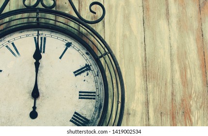 old clock on wall vintage or retro style in vertical with copy space - Shutterstock ID 1419002534