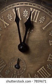 Old clock with roman numerals. Selective focus on number XII.