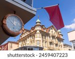 Old Clock and traditional house in Old City of Interlaken, Switzerland