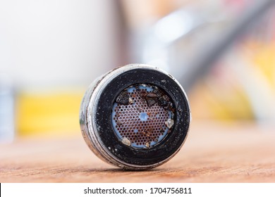 Old Clogged Up Leaking Faucet Aerator With Stone Sand And Calcium Sediment From Hard Water Close Up Macro Shot In The Kitchen Isolated With Shallow Depth Of Field 2020