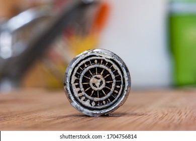 Old Clogged Up Leaking Faucet Aerator With Stone Sand And Calcium Sediment From Hard Water Close Up Macro Shot In The Kitchen Isolated With Shallow Depth Of Field 2020