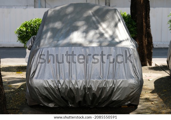 old cloth cover car in\
garden