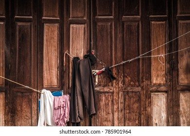 Old clothes hanging at the door.