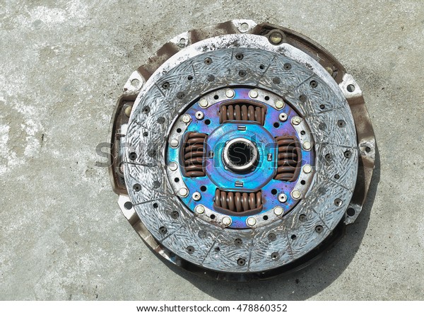 Old\
clutch cover and clutch disc of the truck\
engine