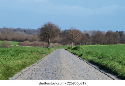 Old cobble stone road through the fields around Asse, Flemish Brabant Region, Belgium