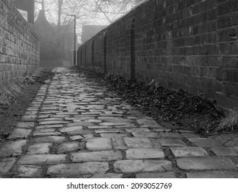 An Old Cobbled Alley Way Path On A Misty Day, At Tring, In Hertfordshire, England.