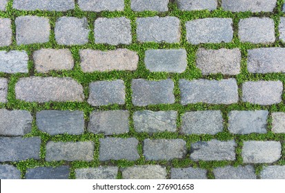 Old Cobblestone Background With Grass