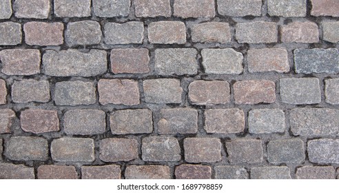 Old Cobblestone Pavement. Overhead View Of Grey Rectangular Stones. Background Texture, Close-up.