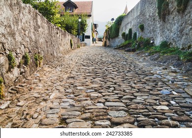 Old Cobblestone Street In Aigle, Switzerland 