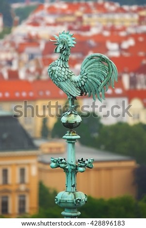 Old cock figure on a cathedral building in Prague