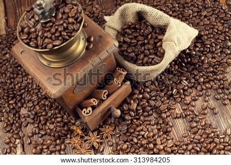 Old coffee grinder and coffee beans 