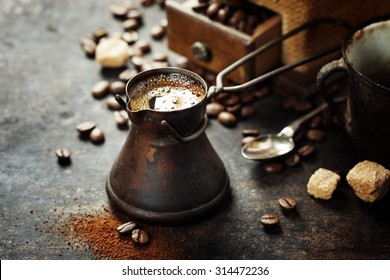 Old Coffee Pot And Mill On Dark Rustic  Background