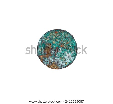 Old coin from the bottom of the sea, oxides, patina, rust, outgrowths of an unusual shape, isolated on white.