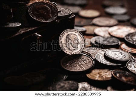 Old coins from around the world from 1940 to the new millennium and vintage container