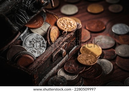 Old coins from around the world from 1940 to the new millennium and vintage container