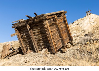 Old Collapsed Wooden Ore Bin At Nevada Gold Mine In Desert.  Ore Hopper And Tailings Pile.