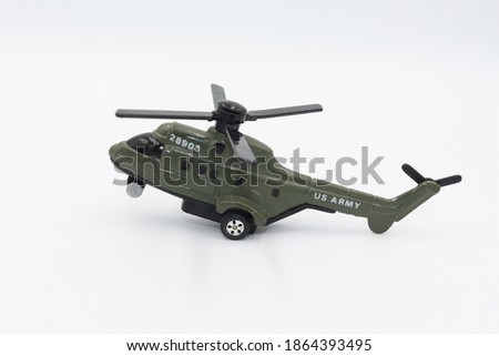 Old collectible toy helicopter on white background