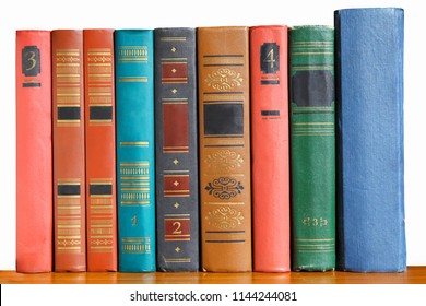 Old color books with numbers on the shelf. Retro-style