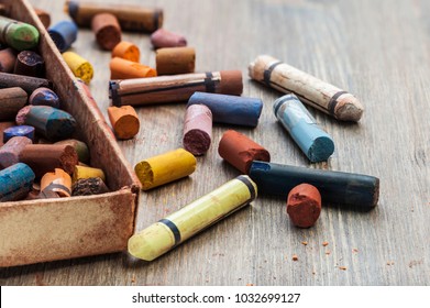 Old Colorful Art Pastel Crayons On A Wooden Background