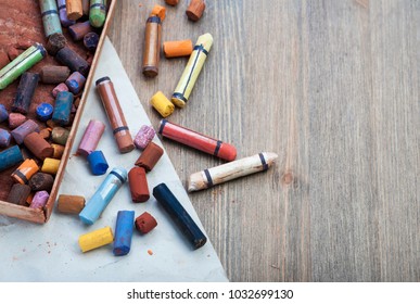 Old Colorful Art Pastel Crayons On A Wooden Background