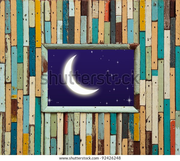 old colorful wood\
wall with moon and star