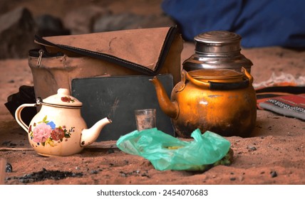 Old coloured metal teapots used in the Sahara desert, Algeria - Powered by Shutterstock