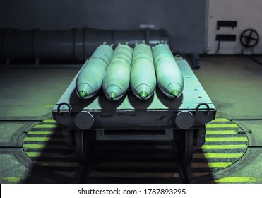 Old combat torpedoes for submarines in an underground storage bunker