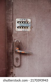 The Old Combination Lock. Entering Or Leaving The House. An Old Metal Door.A Combination Of Numbers. Metal Door.