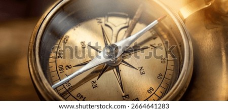Old compass. Macro shot, shallow focus. Travel, geography, navigation, tourism and exploration concept background.  