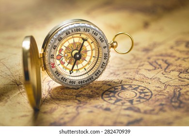Old compass on vintage map. - Shutterstock ID 282470939
