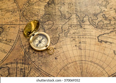 Old Compass On Vintage Map