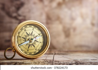 Old compass on vintage map. Retro stale. - Shutterstock ID 378224173