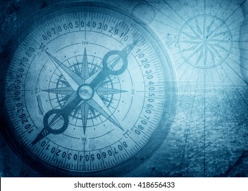 Old compass on vintage map. Pirate and nautical theme grunge background. - Shutterstock ID 418656433