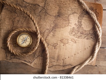 old compass on vintage map 1732 Spain and Portugal (author Ioh.Bapt.Homann) Nurenberg Germany