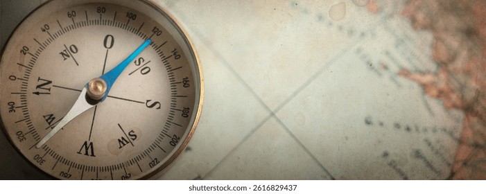 Old compass on world map. Travel, geography, history, navigation, tourism and exploration concept background. Overlay effect. on old paper. ttexture.