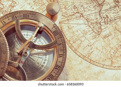 Old Compass Over Ancient Map