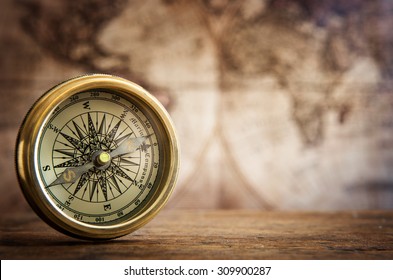 Old compass and vintage map. Retro stale. - Shutterstock ID 309900287
