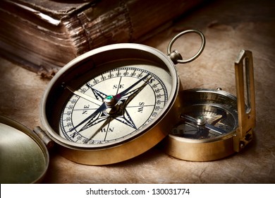 Old compasses on grunge background