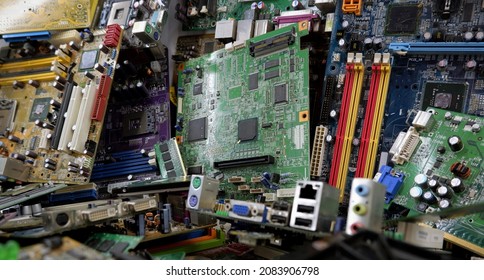 A lot of old computer boards for recycling and recycling electronics. A pile of electronic waste PC, computer motherboard, electronic equipment, printed circuit board. - Shutterstock ID 2083906798